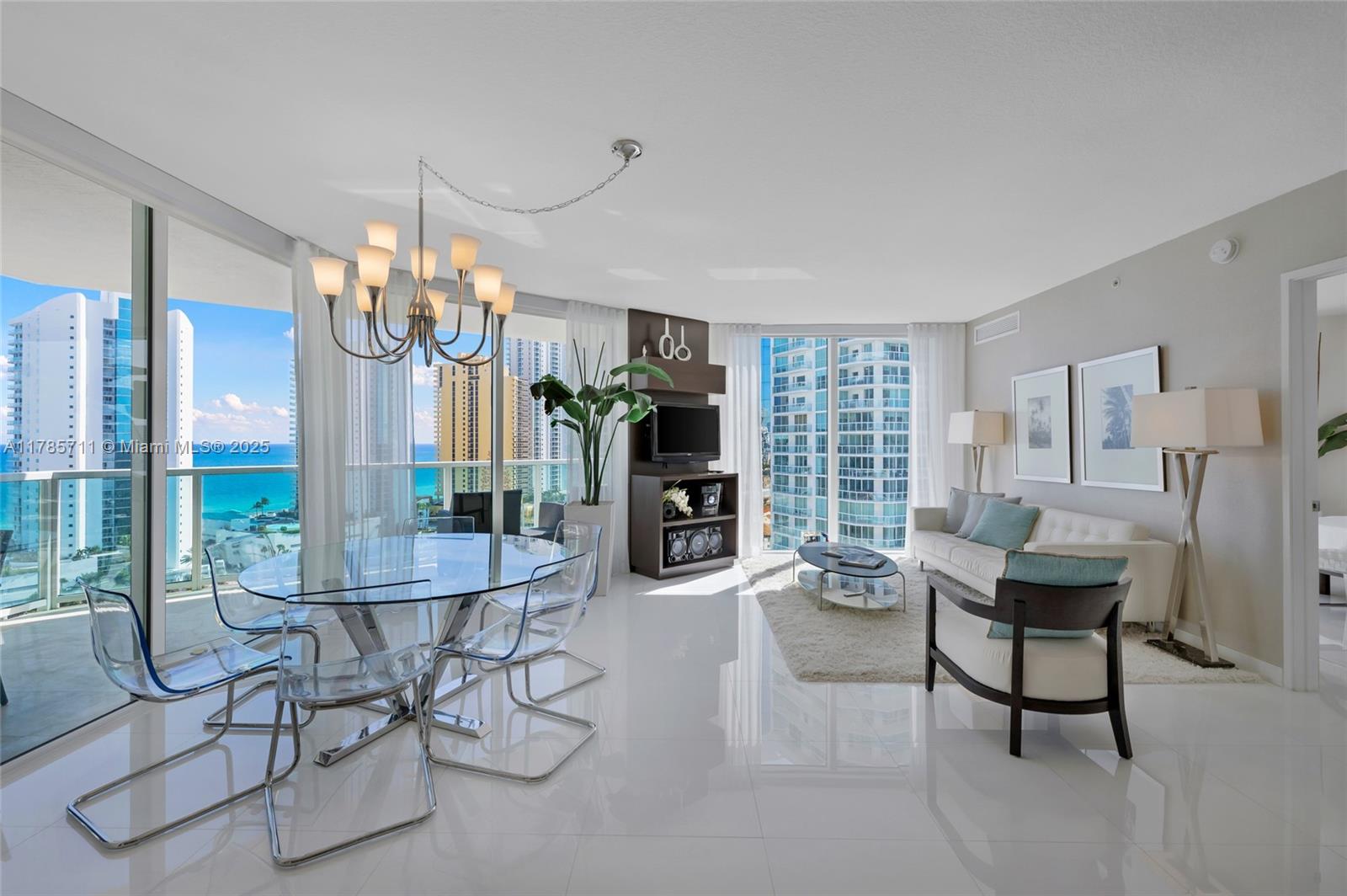 Impeccable unit located steps away from the beach with a spectacular skyline and ocean views! This spacious open concept residence offers 3 bedrooms & 2 baths. Floor to ceiling sliding doors lead to an expansive wrap around terrace off the living and master rooms. With porcelain flooring throughout, gourmet kitchen w/ European cabinets, quartz countertops, SS appliances. This luxury residence is as elegant as it's comfortable. The master suite features an oversized walk in closet and luxuriously appointed bathroom. Add'l features include a spacious laundry room side by side washer and dryer and an abundance of additional storage. Building offers resort-style amenities:BEACH SERVICE, valet, pool, gym & clubhouse.