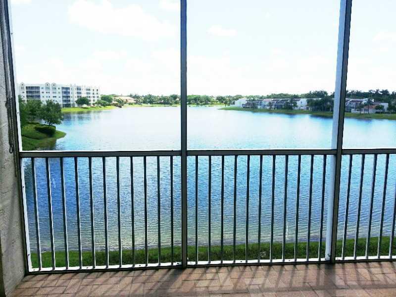 PRESTIGIOUS RESORT STYLE GATED COMMUNITY OF DORAL ISLES! IMAGINE LOOKING AT BEAUTIFUL, UNOBSTRUBTED LAKE VIEWS EVERYDAY! UNIT HAS KITCHEN WITH GRANITE CONTERTOPS, TILE THROUGHOUT, SCREENED BALCONY. EXCLUSIVE CLUBHOUSE w CASCADE POOL, GYM, SAUNA, PARTY ROO M, BEACH, BASEBALL & SOCCER FIELDS & MORE. CLOSE TO MAIN MALLS, AIRPORT, MAJOR ACCESS ROADS & A+ SCHOOLS. EASY TO SHOW.