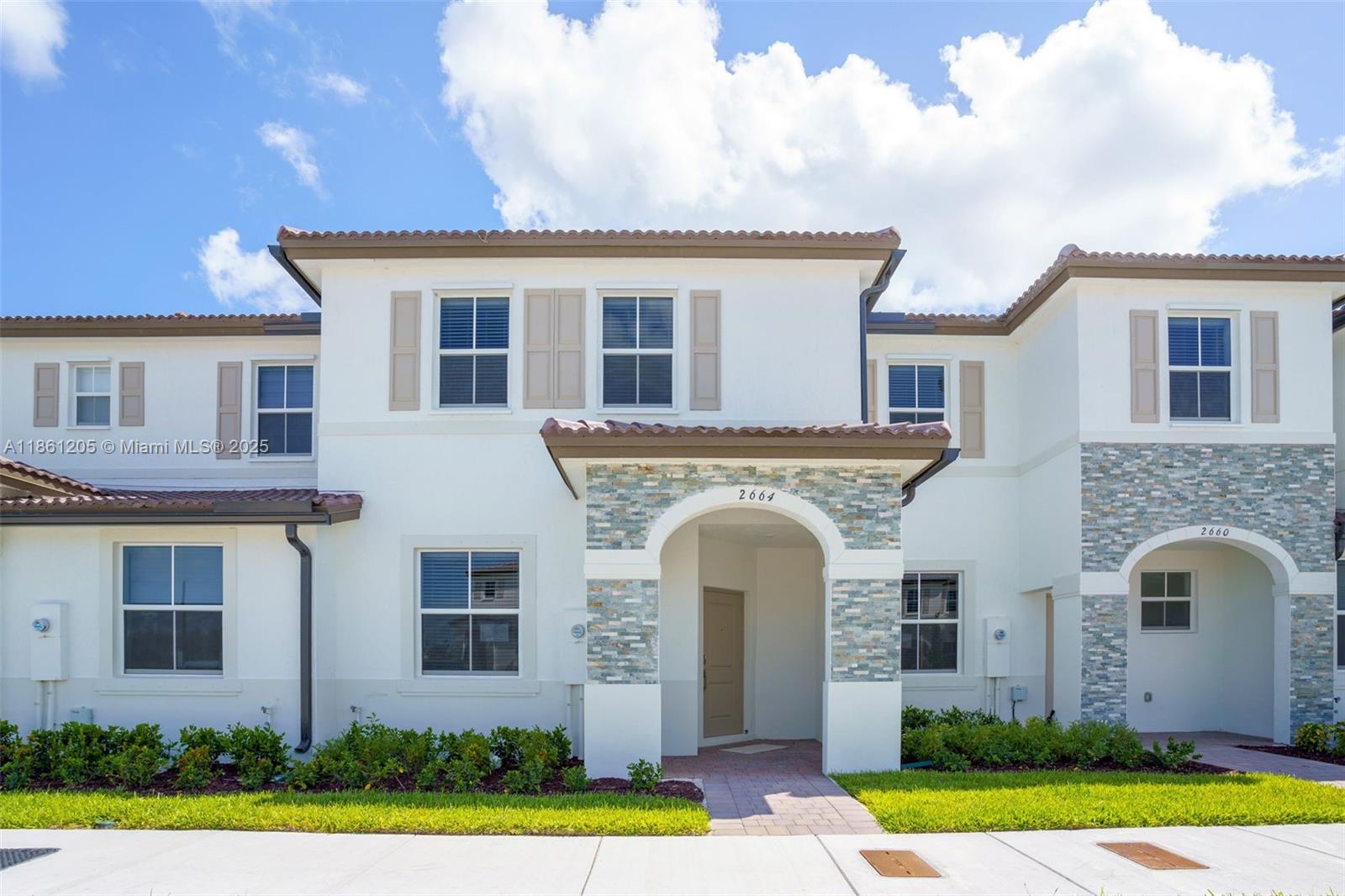 New Construction two-story townhouse boasts three spacious bedrooms, two full bathrooms, and a half-bath. The open layout features a family room, dining area, and kitchen, along with a separate living room for additional relaxation and entertainment space. All bedrooms are conveniently located on the second floor. The kitchen is outfitted with stainless steel appliances, quartz countertops, and ample cabinet storage. A large, fenced patio provides the perfect spot for unwinding or hosting guests. Ideally situated near schools, Turnpike Exit 2, shops, restaurants, a hospital, the Amazon Distribution Center, and Homestead Air Base.