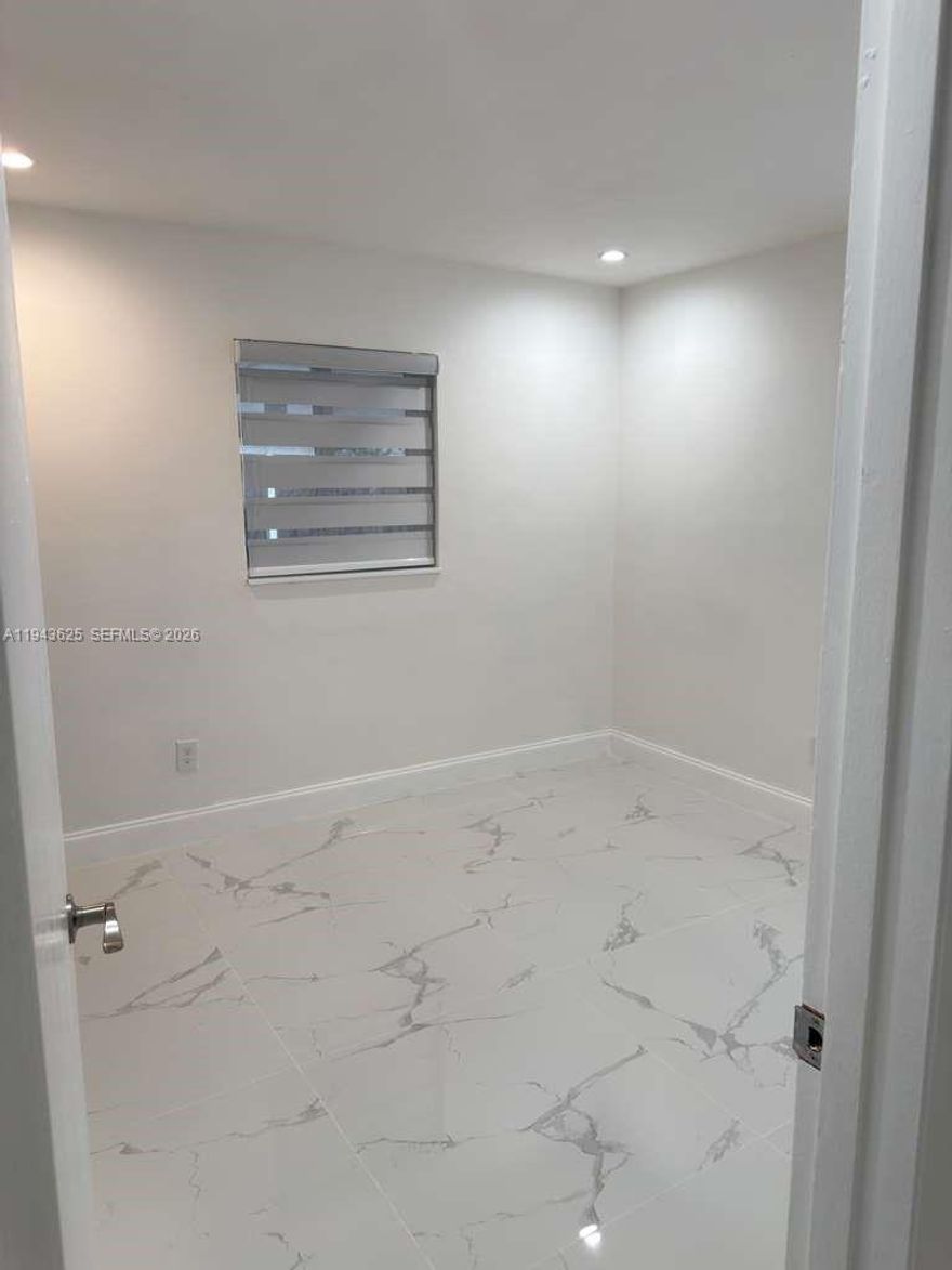 Charming 2 bedrooms, 1 bathroom, living room, dining room, kitchen, patio, and laundry room  Tile flooring throughout, ,Located in a quiet residential neighborhood with easy access to NW 183rd St, Florida Turnpike, schools, and shopping. Freshly painted and move-in ready. Quick approval process. All utilities included  No HOA. Easy to show .