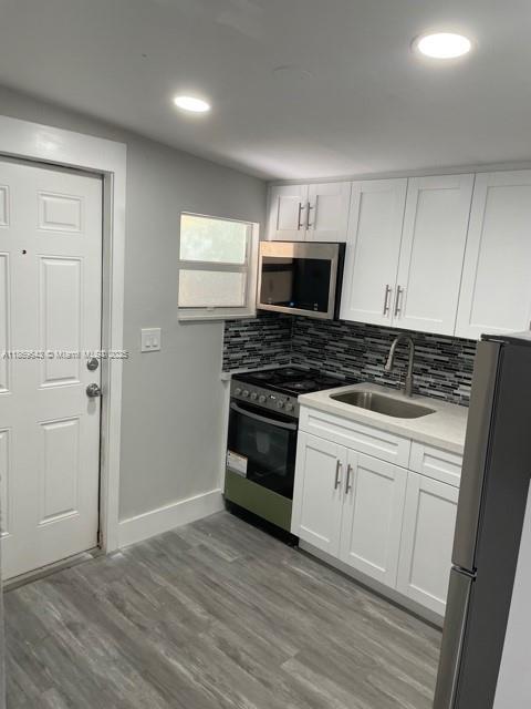 Beautifully renovated spacious bedroom 1 bath located in North Miami Beach. New kitchen with granite countertop and stainless steel appliances, New mini-split AC and recessed lights throughout. Large lot with fenced in yard space. Private entrance and parking. Washer & Dryer is on-Site. Minutes away from Aventura, beaches, parks, local transportation, dining & shopping. Electricity & Water is included in rent.