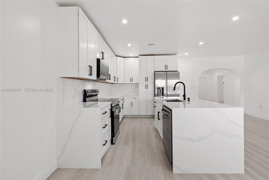 Welcome to this spacious home on a quiet cul-de-sac in a highly desirable community. Offering 5 bedrooms and 2 full bathrooms. This home also features a large family room providing flexible living options for extended family, an open floor plan creates a bright, airy atmosphere. Perfect for entertaining or enjoying quality time with loved ones. This turnkey property features Brand-new roof brand-new Impact Window, new tankless water heater, new stainless-steel appliances, washer/dryer, brand-new bathrooms, brand-new modern, kitchen with sleek finishes that make cooking and entertaining a joy. Freshly renovated with attention to detail. The home offers a bright, open feel and move-in-ready convenience. Close to schools, parks, shopping, and everyday amenities, this home combines comfort, functionality, and an unbeatable location.