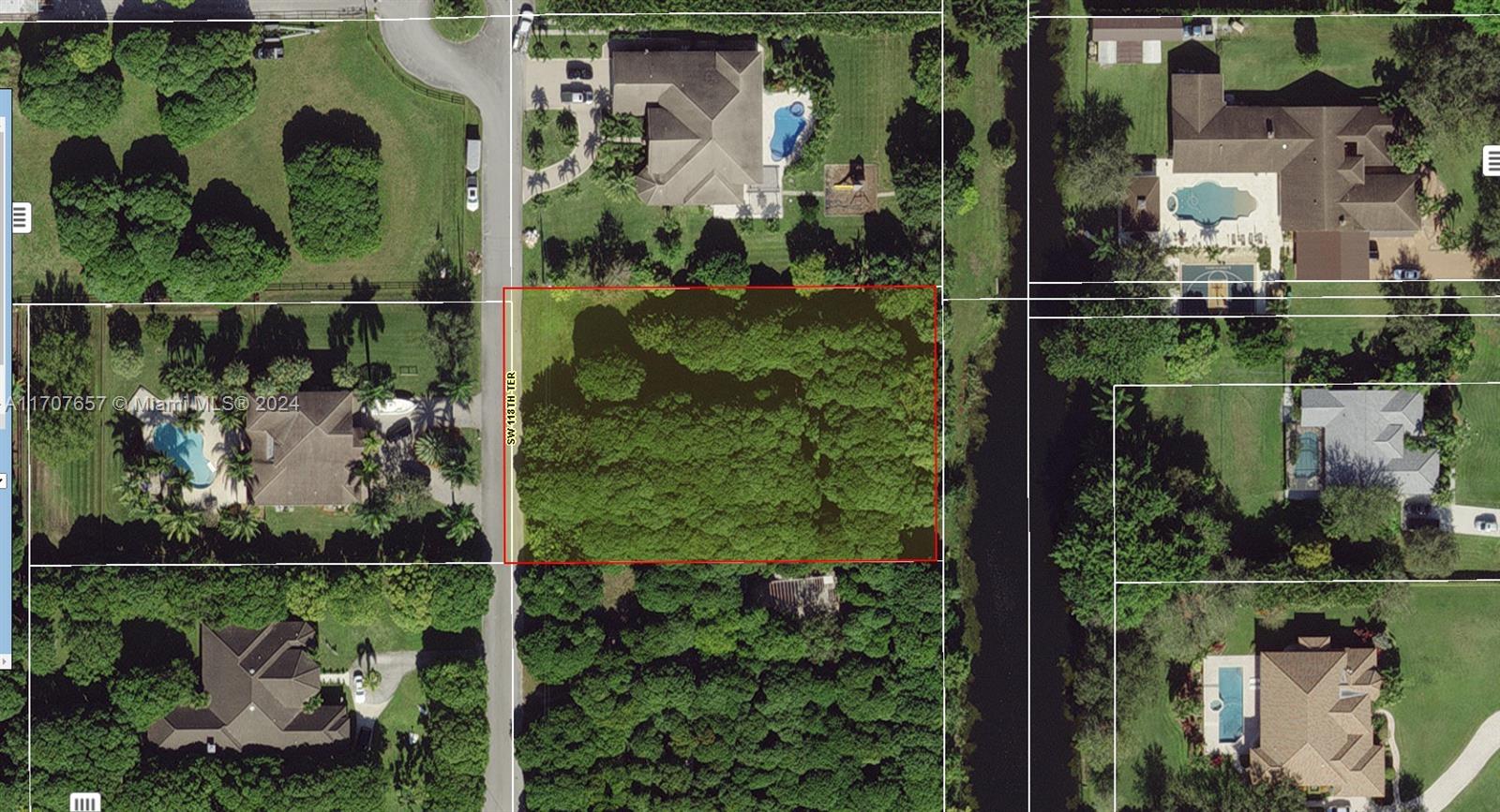 Beautiful lot in highly desired Davie area. Unique location, dead end street with very large houses. Part of the Lychee Woods Plat. Over 20 Lychee trees, 7 mango trees + other fruit trees on the property. 160 feet Canal frontage on back. Very secluded on a private asphalted road. Plans are available for a large 4 bed, 4 Baths, Office/Study (could convert to 5th Bed; Dinning Rm; 2 car garage plus large workshop area; Walk-in closets; fam rm; breakfast area; 3900 sq. ft. under air (living) & almost 5000 sq. ft total area. Pool design and plans finalized. Only waiting on final SEPTIC documentation and permits to begin construction. Demock was done and lot has been partially filled with lime rock /other fill. Agricultural zoning could reduce taxes if used in full or partially for AG purposes.