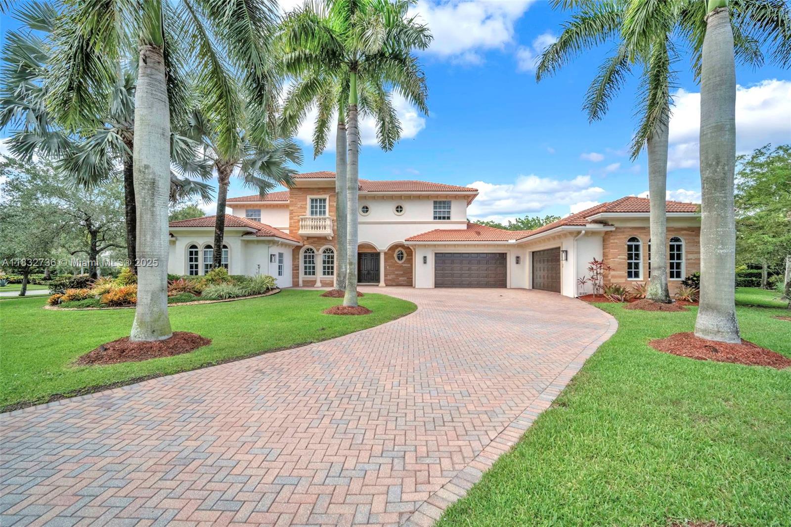Exquisite Modern Contemporary Estate in Weston’s prestigious and affluent neighborhood of Windmill Reserve. Welcome to this beautifully designed modern contemporary estate, Situated on an expansive 43,722 sq ft lot, this stunning residence offers 6,702 sq ft of luxurious living space, thoughtfully crafted with imported Italian marble throughout, dual two-car garages, full impact glass windows and doors, and an oversized resort-style pool. This impressive home boasts 6 spacious bedrooms, 6 full bathrooms, 2 half baths, a versatile playroom, a private office or studio ideal for remote work or creative pursuits. The gourmet kitchen is outfitted with sleek Brand New Mia Cucina Italian cabinetry and top-of-the-line Wolf/Sub-Zero stainless steel appliances, perfect for culinary enthusiasts.