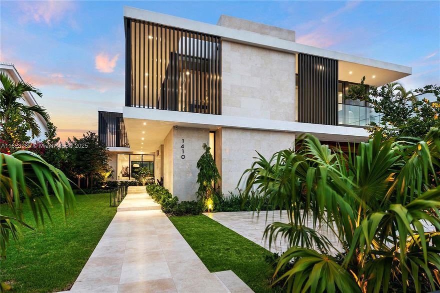 Villa Nova is a stunning modern design located within gated Biscayne Point. Newly constructed to capture breathtaking sunrise and sunset views, perfect for entertaining. Premium finishes, the home features 6 bedrooms and 7 bathrooms across an 11,250SF lot with 75ft of prime waterfront. Architectural elegance is expressed through limestone cladding, aluminum louvers, and white oak flooring. The exterior is finished in travertine, while the garage is wrapped in rich ipe wood. A Boffi XILA walnut kitchen and limestone-clad Boffi bathrooms enhance the luxury. Venetian plaster walls, soaring ceilings, and a floating concrete staircase create an atmosphere of refined architectural sophistication. Enjoy a heated saltwater pool and spa, along with fully integrated smart home technology.