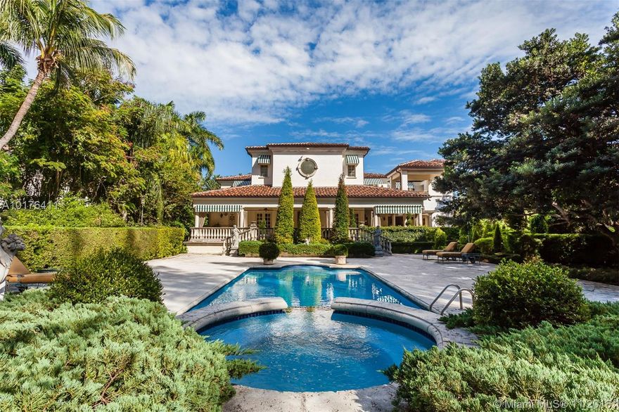 This spectacular Tuscan estate sits on a 41,320 sf lot in the esteemed private guard-gated community of Tahiti Beach. Set amongst a lushly landscaped garden and sparkling pool, the home provides a serene setting for entertaining or relaxation. Exquisite design details are exemplified throughout, including the grand family room with 38 ft. ceilings, master bedroom with sitting room and en suite bathroom and an incredible three room wine cellar. Community amenities include a private beach & 3 tennis courts.