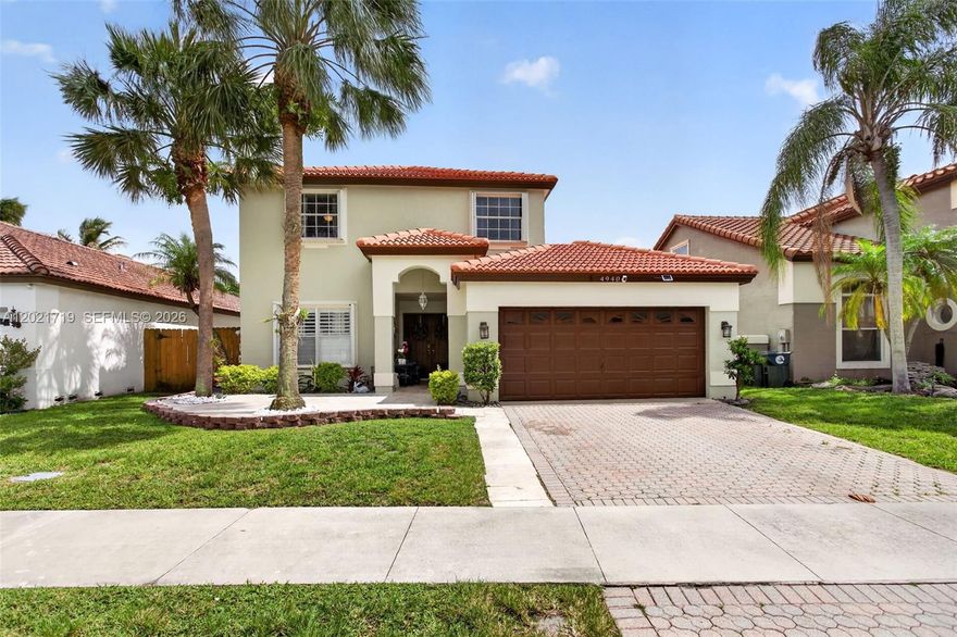Welcome home to this spacious 4-bedroom, 2.5-bath home with just under 2,300 sq ft in the heart of Coconut Creek. The open layout is highlighted by a beautifully renovated kitchen featuring white shaker cabinetry, granite countertops, tiled backsplash, stainless steel Bosch appliances, and a large blue center island with cooktop, microwave, oven, and wine cooler. The first floor offers wood laminate flooring and a large primary suite with walk-in closet, dual sinks, soaking tub, and separate shower. Upstairs features real hardwood flooring on the stairs and landing along with spacious secondary bedrooms with wood laminate. Enjoy the oversized backyard with patio, pool, and plenty of room to roam or entertain. Major updates include Bosch appliances (2022), upgraded laundry room featuring custom cabinetry, granite countertops, & washer/dryer replaced in (2022), A/C (2017), water heater (2016), and roof (2006). Low HOA and fantastic community amenities.