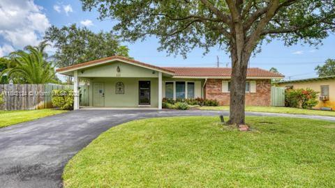 Beautifully and spacious home in the heart of Pompano Beach. This property features a large eat-in kitchen with stainless steel appliances and custom solid wood cabinetry, impact windows, updated bathrooms, and an indoor laundry room. The fully fenced backyard includes a pool and plenty of space for outdoor enjoyment. Conveniently located near the beach, trendy restaurants, shops, breweries, a cultural center, and tennis courts. This is a must-see property that offers the perfect blend of comfort and location. Act fast—this one won't last long!