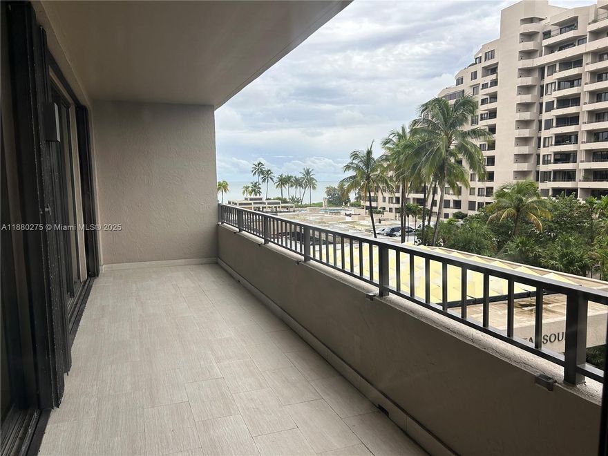 Very well-kept 2/2 unit at OceanSound with pleasant views of gardens and ocean from a large balcony. Unit has tile floors throughout, a high glossy ceiling, upgraded closetsand bathrooms. Kitchen is equipped with excellent quality appliances including a wine cooler and reverse osmosis water filtration system. Storage Closet.  Community has direct beach access, beach chairs and umbrellas are provided, pool with BBQ area, gym, party room, and a beauty salon and deli. Easy to show.