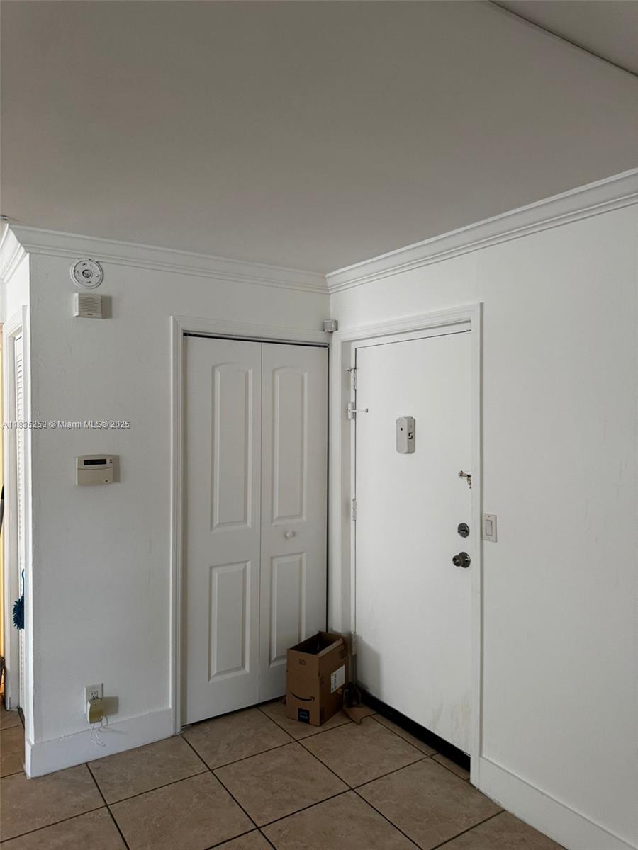 Ground-level unit with private entrance from the parking lot. in the heart of Lauderhill, conveniently located next to 441 and between I95 and Turnpike. 2 Closets on the Master bedroom a regular one and a walking closet. Water-resistant laminate, and tile. Secured lobby. Community pool. NO LEASING