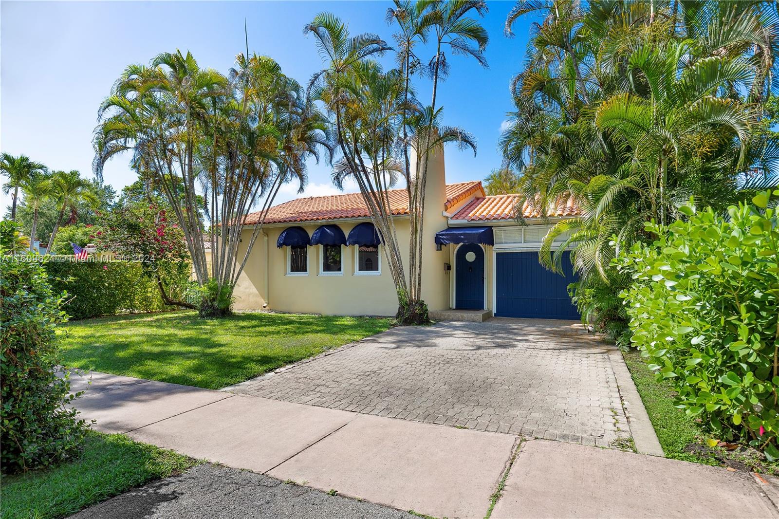 Beautiful 1937 Old Spanish in highly desirable neighborhood of Coral Gables featuring three bedrooms, two bathrooms. Spacious and open concept, living/dining features 17 foot vaulted exposed pecky cypress wood beam ceilings, a wood burning fireplace with marble mantle/floor accents & refinished original hardwood floors. Bedrooms have ample walk-in closets. Renovated kitchen includes an oversized pantry, French doors that open to a garden patio. Welcoming sunroom opens to a large terrace perfect for outdoor entertaining and large backyard.