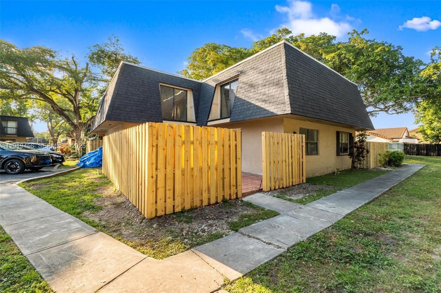 Completely remodeled 2-bed, 2.5-bath townhome located in the desirable community of The Hammocks. This modern residence features an open-concept layout with abundant natural light and brand-new waterproof flooring. The kitchen has been beautifully redesigned with two-tone cabinetry, quartz countertops, and stainless-steel appliances. Spacious living areas flow into a private tiled courtyard, ideal for entertaining. Each bedroom upstairs includes balcony access and updated bathrooms. Enjoy resort-style amenities including pool, gym, and walking trails. Conveniently located near top schools, shopping, and major highways. Move-in ready!