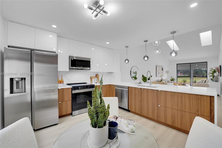 Stunning, beautifully renovated top-floor with sought-after southern exposure and unobstructed golf course & lake views. Located in prestigious Boca Pointe, this residence offers country club living with no mandatory membership. This light-filled home features 1,600 sq. ft. of living space with vaulted ceilings and sjylights briging a lot of additional natural lights. The brand-new open kitchen showcases quartz countertops, modern cabinetry, and new stainless-steel appliances, ideal for both everyday living and entertaining. Enjoy fully updated bathrooms and new flooring throughout creating a fresh, contemporary feel.  New AC & water heater. Very nice pool into the community. This exceptional home is truly a must-see—schedule your showing today!