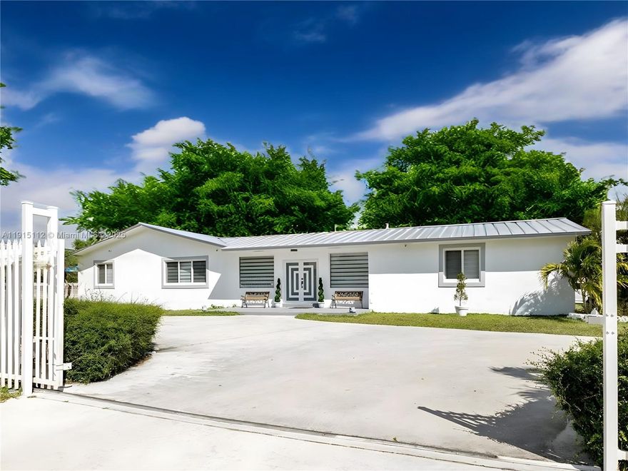 Mid-century modern home on a rare 31,708 SF corner lot – one of the largest in the neighborhood. Expansive 2,816 SF layout with 4 beds, 2 baths plus an Entertainment Lounge with full 2nd kitchen, ideal for hosting, multigenerational living or game day. Thoughtfully renovated and truly move-in ready, featuring high-end finishes, new flooring, all-new SS appliances, new A/C, newer metal roof and impact windows/doors. Attached 1/1 in-laws home, ample room for a future pool, generous parking and a gated feel complete this exceptional Miami property. Oversized yard offers space for outdoor living, gardening and play, surrounded by mature landscaping for added privacy. No HOA makes this a rare opportunity to enjoy flexibility, storage and the freedom to personalize your lifestyle and parking.