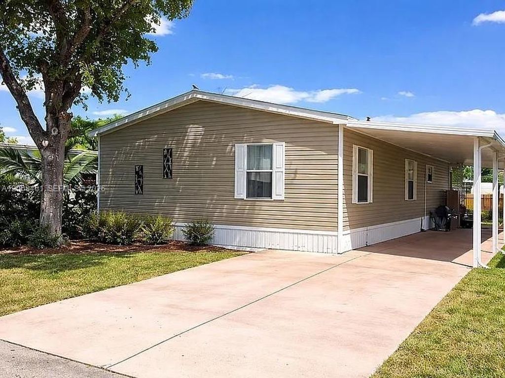 Photo of 390 NW 134th Ave, Plantation, FL 33325 (MLS # A12008461)