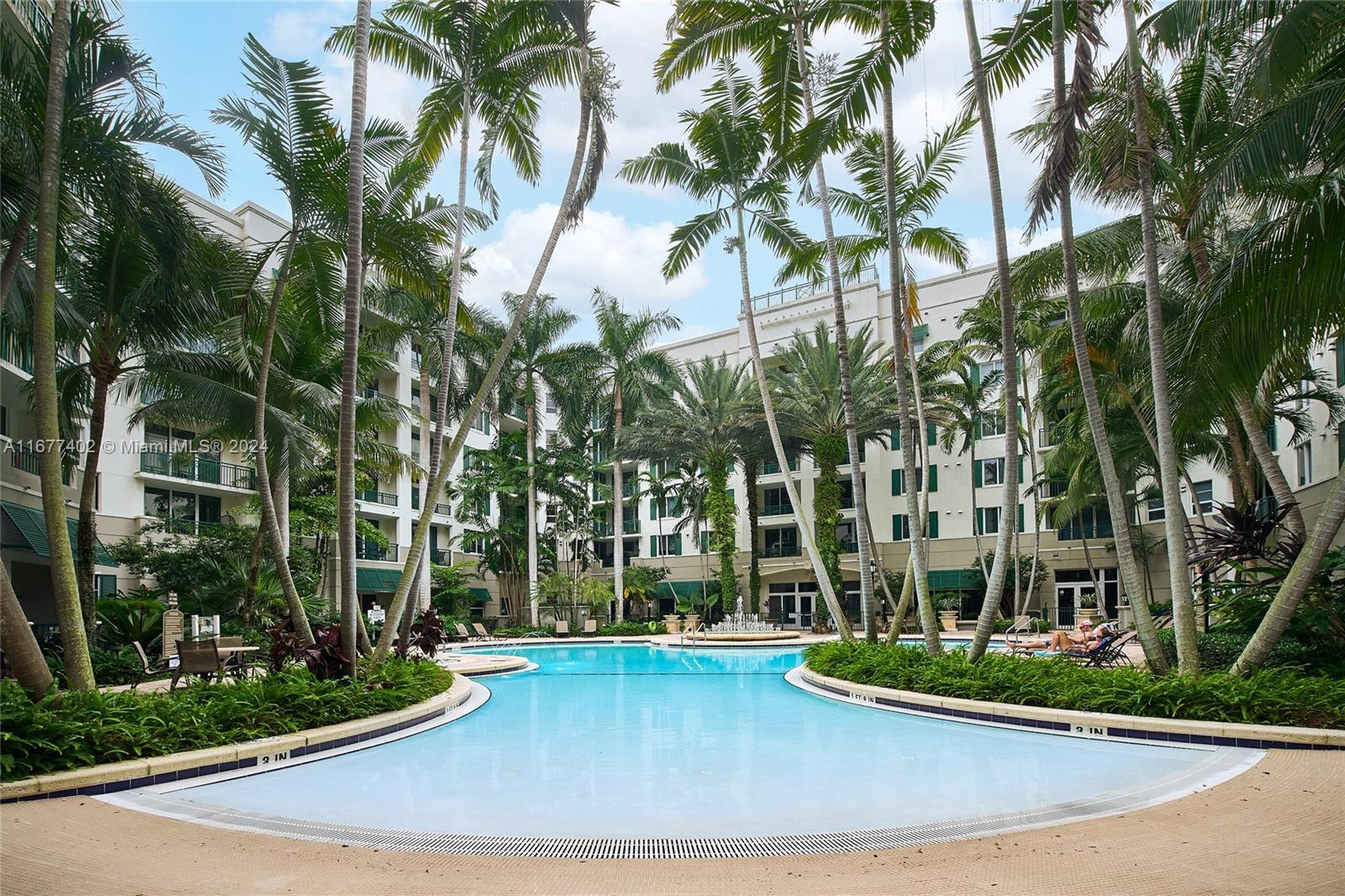 This spacious & inviting 2-bed, 2-bath condo offers the ultimate luxury lifestyle in the heart of Plantation. Featuring an open layout, the bright living area opens to a private balcony through floor-to-ceiling sliders. The modern kitchen includes granite countertops & SS appliances, while the master suite boasts a Roman tub, separate shower, & large custom walk-in closets. With impact windows/doors, & Washer/Dryer, this unit is move-in ready & includes an extra storage unit worth about $10K. Unbeatable convenience with 2 assigned parking spaces. Resort-style amenities include a tropical pool, jacuzzi, fitness center, sauna, 24-hour manned security, & more. HOA fees cover cable, internet, & water. Walking distance to restaurants, shops, Publix, & new Plantation Walk!