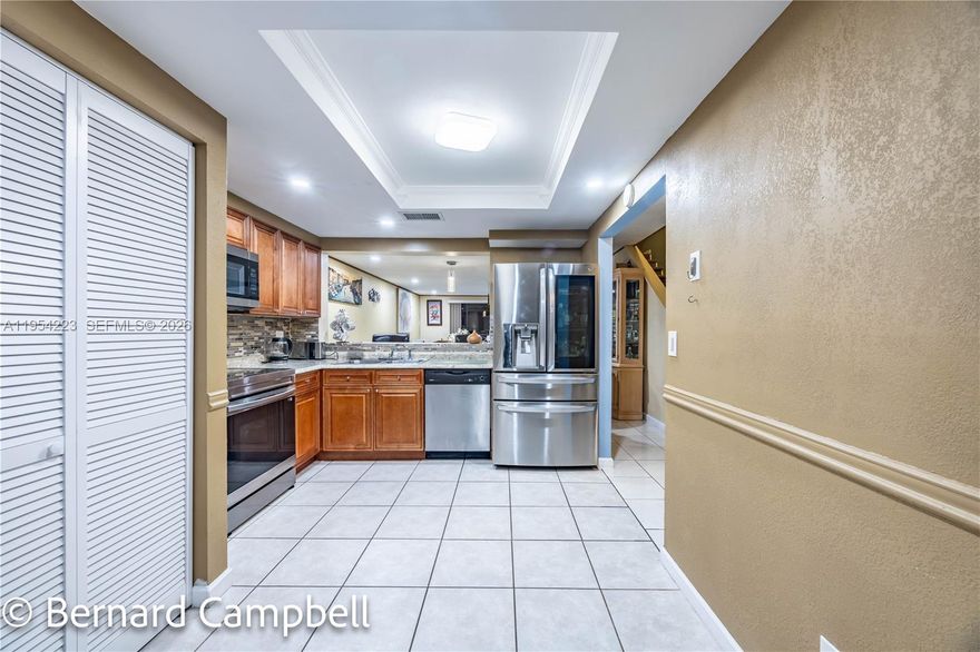 Welcome to this beautiful and spacious 3-bedroom, 2.5-bath townhouse offering 1,429 sq ft of comfortable living space in an all-community neighborhood. This rare corner unit features a spectacular water view and a well-designed two-story layout. The first floor showcases durable tile flooring, while the upstairs bedrooms feature elegant laminated wood floors. The spacious kitchen is fully equipped with stainless steel appliances, ample cabinetry, and additional features that make it perfect for everyday living and entertaining. This home has been well maintained by the owners. Enjoy access to a community pool and the convenience of nearby shopping malls, schools, grocery stores, and entertainment options. This unit truly stands out from others in the community with its location, views, and layout. Rental is allowed immediately. Schedule your appointment today—this one won’t last!