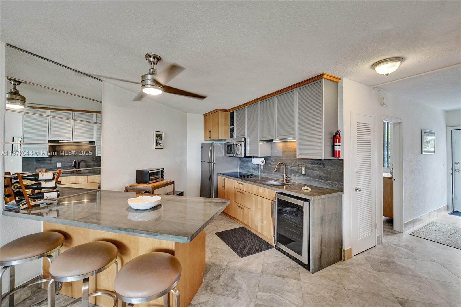 LOCATION: Just step out your front door and sink your toes right on the beach. Enjoy morning coffee at the pool, enjoying beautiful Sunsets & Sunrise views. This impeccably undated Unit features 2 bright/spacious bedrooms & 1.5 updated bathrooms, step in shower. Large Open recently updated concept kitchen features SS appliances. Beautiful porcelain tile throughout Quartz Countertop Impact Windows & front Door & Accordion shutters. Bldg has passed both 40 & 50 year inspections. Low HOA. No current assessments. Unit is located on the 1st floor with parking spot right in front of the unit. Common Laundry on 1st floor. Heated Pool. Rent 1x lifetime. No pets. Publix right up the street, Close to Gulfstream Racetrack, Casinos, Ft Lauderdale Airport Fully furnished. Updated electric & pluibing