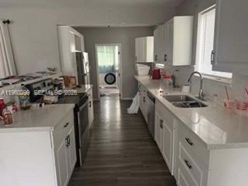 Photo of 4841 NW 12th Ct, Lauderhill, FL 33313 (MLS # A11960299)