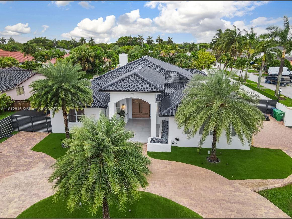 This stunning, fully gated one-story estate is ideally located in the heart of Miami, just minutes from top-rated schools, popular local hotspots, and a sprawling public park. Boasting nearly 4,183 square feet of elegant living space (over 4,732 total square feet), this meticulously designed residence offers 4 spacious bedrooms and 3 luxurious full bathrooms. Step inside to discover an expansive open-concept layout featuring a designer kitchen with premium finishes and top of the line appliances seamlessly flowing into the living area. A butler’s pantry leads to a spacious 3-car garage, EV-ready to accommodate up to six vehicles.The backyard is a private oasis, featuring a spectacular pool with a spa and a beautifully designed entertainment area.