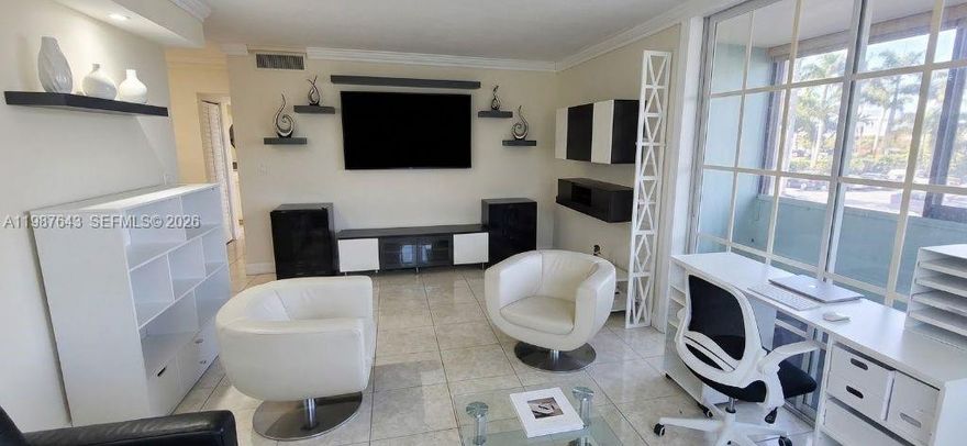 Centrally located 3/2 plus den condo in Half Moon Towers offering exceptional convenience in a prime location. Just minutes away from Miami International Airport, Dolphin Express (836), Palmetto Expressway, making it easy to reach hot spots like Brickell, Coral Gables, Downtown Miami, The Art District and Beaches. For shopping and everyday convenience, you're surrounded by plazas, plus larger retailers just a short drive away. This second-floor unit features a functional and spacious layout with a large living room & built in dining table with granite counter tops, stainless steel appliances, in unit washer & dryer, tile flooring throughout. Two assigned parking spaces.