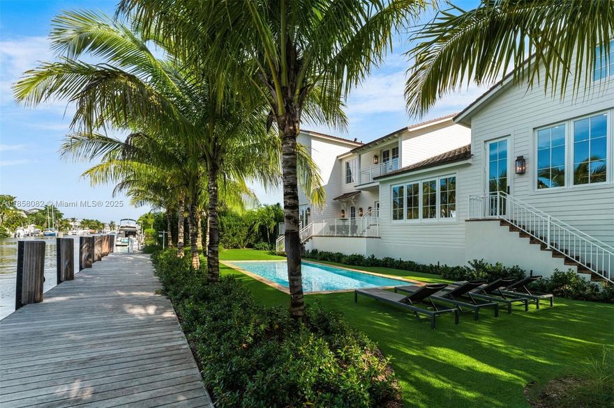 A Yachtsman’s dream home totally new 2025 rebuild sits high on a 12,000 SF direct ocean access lushly landscaped tree-shaded interior lot on a quiet cul de sac street in the highly regarded Gables by the Sea guard-gated community. This New England style 2-story 5 bdrm 4.5 bth home is filled with designer selected finishes and boasts over 6,000 total sq ft  of fine craftsmanship, solid wood flooring, calacatta marble and the most beautiful kitchen ever! Spacious layout, high ceilings and abundant natural light. Direct no-bridge ocean access features 25,000 lb boat lift, 100' seawall, 80' ipe wood dock, 2 full dock towers & pilings, all brand new. Generator-ready. Four-car lift-capable garage. Coral Gables premier ocean access guard-gated community has the best in schools & nearby amenities.