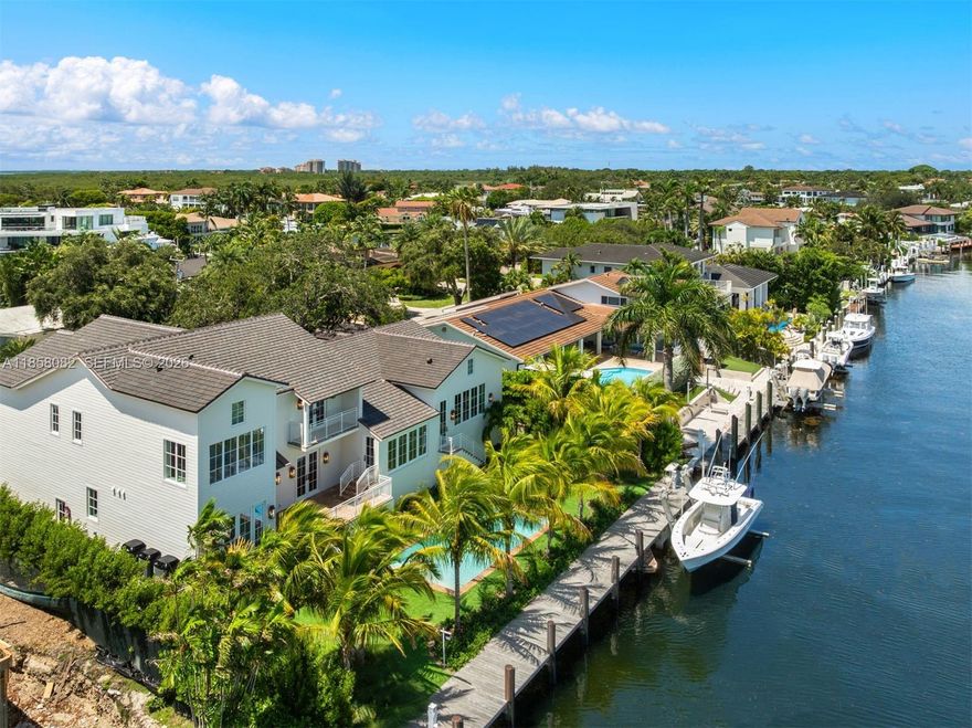 A Yachtsman’s dream home totally new 2025 rebuild sits high on a 12,000 SF direct ocean access lushly landscaped tree-shaded interior lot on a quiet cul de sac street in the highly regarded Gables by the Sea guard-gated community. This New England style 2-story 5 bdrm 4.5 bth home is filled with designer selected finishes and boasts over 6,000 total sq ft  of fine craftsmanship, solid wood flooring, calacatta marble and the most beautiful kitchen ever! Spacious layout, high ceilings and abundant natural light. Direct no-bridge ocean access features 25,000 lb boat lift, 100' seawall, 80' ipe wood dock, 2 full dock towers & pilings, all brand new. Generator-ready. Four-car lift-capable garage. Coral Gables premier ocean access guard-gated community has the best in schools & nearby amenities.