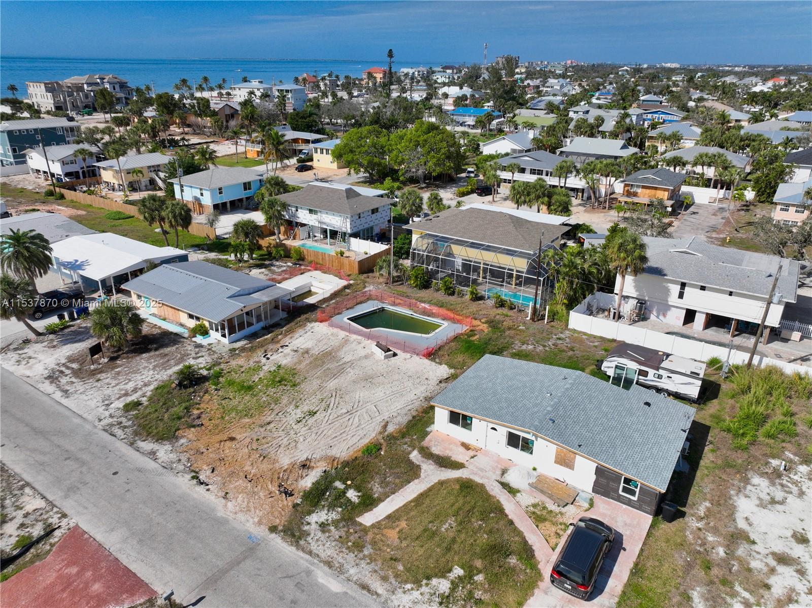 Desirable single-family pool lot on Fort Myers Beach! Located mid-island, this property offers a peaceful retreat while still being conveniently close to all the action. Enjoy the quiet comfort away from the crowds, yet just a short walk to the beach.This prime location offers Grocery & Dining: Only 8 blocks to the island's only Publix grocery store, Snook Bight Marina, and two popular restaurants.: A short distance to Times Square and Margaritaville, offering a variety of dining and entertainment options. Essentials: . We can connect you with builders who offer everything from elevated prefab modular homes to traditional and custom designs, ensuring your vision becomes a reality. rebuilding stronger than ever, and this is the perfect time to invest in your island paradise.