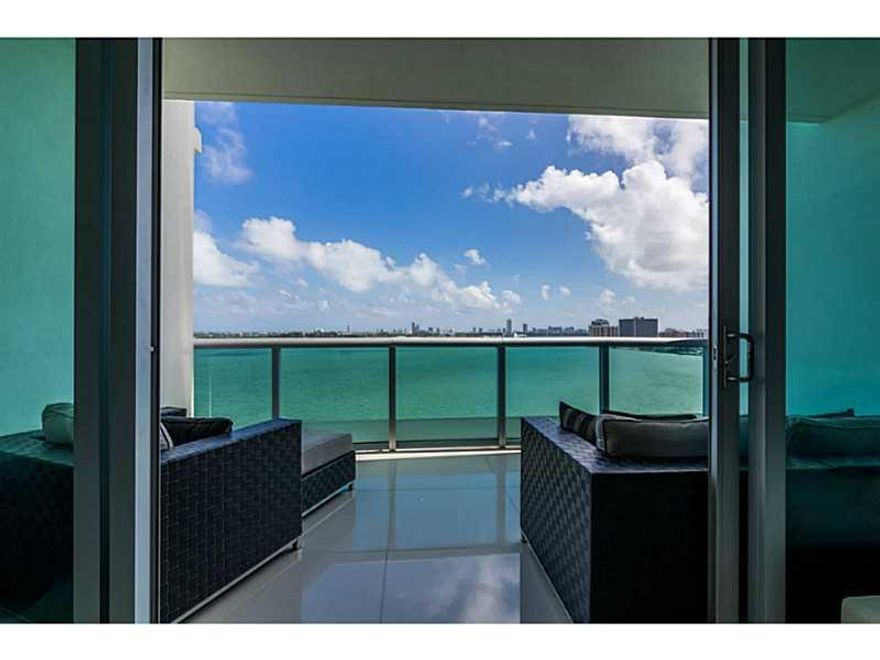 This 2BR/2.5BA double-high loft features amazing views of the bay and large den that could be converted into 3rd bedroom.  Private elevator, large balcony and living areas create perfect space for entertaining. Italian cabinets with granite counter tops,  S/S appliances, marble floors, floor-to- ceiling impact windows, rooftop pool, gym, community room, 2 parking spaces and more!