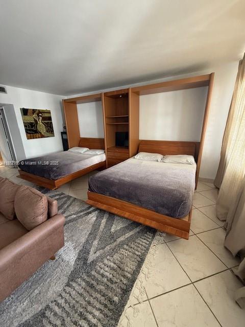 Living in front of the ocean, Cozy Studio with a charming balcony nestled within the vibrant Decoplage Condo, centrally located in the bustling heart of South Beach. Situated opposite the prestigious Ritz Carlton Hotel, this residence is a seamless blend of comfort and convenience, awaiting your immediate occupancy. The apartment boasts elegant tile flooring throughout, modern stainless-steel appliances, a bathtub/shower combination, and two spacious queen-sized murphy beds, alongside a plush sofa and a generous walk-in closet.