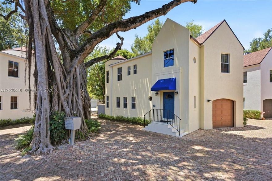 FREE-STANDING French Country-style home in a gated community located on one of the best streets known for being quiet, low-traffic in the heart of Center Grove.  Just steps from three neighborhood parks including Lincoln park directly across the street and within walking distance to Cocowalk shops and restaurants. The home offers exceptional privacy and tranquility. Filled with natural light, the residence features elegant travertine marble floors on the main level and hardwood flooring throughout all of the bedrooms. A welcoming foyer entrance leads to an updated spacious kitchen and large living area. Enjoy a private patio, perfect for outdoor entertaining. The property includes a one-car garage plus an additional assigned gated parking space.  All three bedrooms feature vaulted ceilings, including a spacious primary suite with a sitting area and a separate private office space. Additional highlights include a new roof, newer appliances, a newer A/C system, and a very well-managed association.