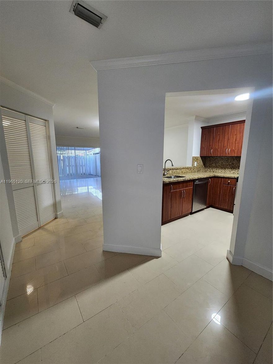 Great fully upgraded Townhouse in Sunset Harbour in Kendall! This comfortable 3 bedroom & 3 full bathroom offers a downstair Bedroom with a full bathroom, a very spacious living/dining area, updated kitchen complete granite countertops, wood cabinetry & SS appliances. The two bedrooms upstairs have a full bathroom each. Tile floor. Upgraded hurricane shutters. The low $95 per month HOA dues cover the common areas, such as pool, tennis, racket courts, & clubhouse. There are 2 assigned parking spaces right in front of unit, plus plenty of guest parking nearby. The backyard patio is wonderful & very private, near schools, shopping center, restaurants, major expressways.  Great home for 1st time buyers! Come see it!