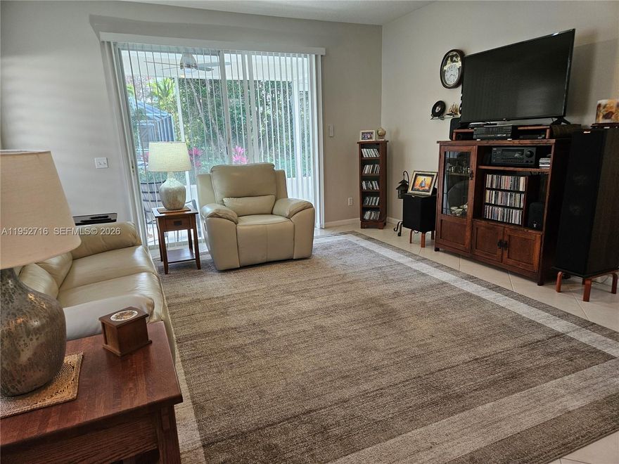 Lovely 3BR/2BA/2CG villa in the gated community of Summerfield. This light and welcoming home features an open split-bedroom layout, high ceilings, neutral finishes, and a tranquil garden view that brings natural privacy and calm. The primary suite offers a walk-in closet and an ensuite bath with dual sinks and a walk-in shower. The kitchen provides generous cabinetry, a breakfast area, and open sightlines to the living and dining spaces for an easy flow. Updated baths, abundant storage, newer fans, all new window treatments, a newer air conditioner, newer water heater, and a newer garage door opener enhance comfort and efficiency throughout. A large covered screened patio overlooks lush landscaping and extends the living space. Additional highlights include full hurricane protection. Summerfield is known for its beautifully maintained grounds, quiet streets, and friendly atmosphere. The community also borders the Champions Club at Summerfield, a public golf course designed by Tom Fazio, offering convenient access without mandatory membership. Residents enjoy a clubhouse, fitness center, heated pool, tennis and pickleball courts, and miles of sidewalks for walking and biking.  Low HOA fees include gated security, basic cable, internet, and access to all amenities. Conveniently located near shopping, dining, beaches, and I-95, this community offers comfort, value, and low-maintenance living. visit Summerfield Stuart for comm. info