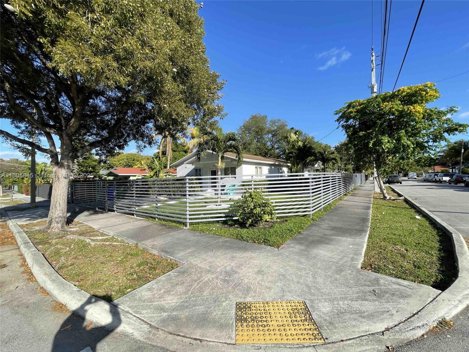 Stunning duplex on a massive 8,640 Sq.Ft corner lot in one of Miami's fastest-growing areas. Each updated unit features 2 bedrooms, 1 bathroom, a stylish kitchen, bright living/dining area, and private entrance. The property is fully fenced with great outdoor space and tropical landscaping, ideal for end-users or investors. Just minutes from Wynwood, Midtown, and the Design District. Fully leased until October 2025.