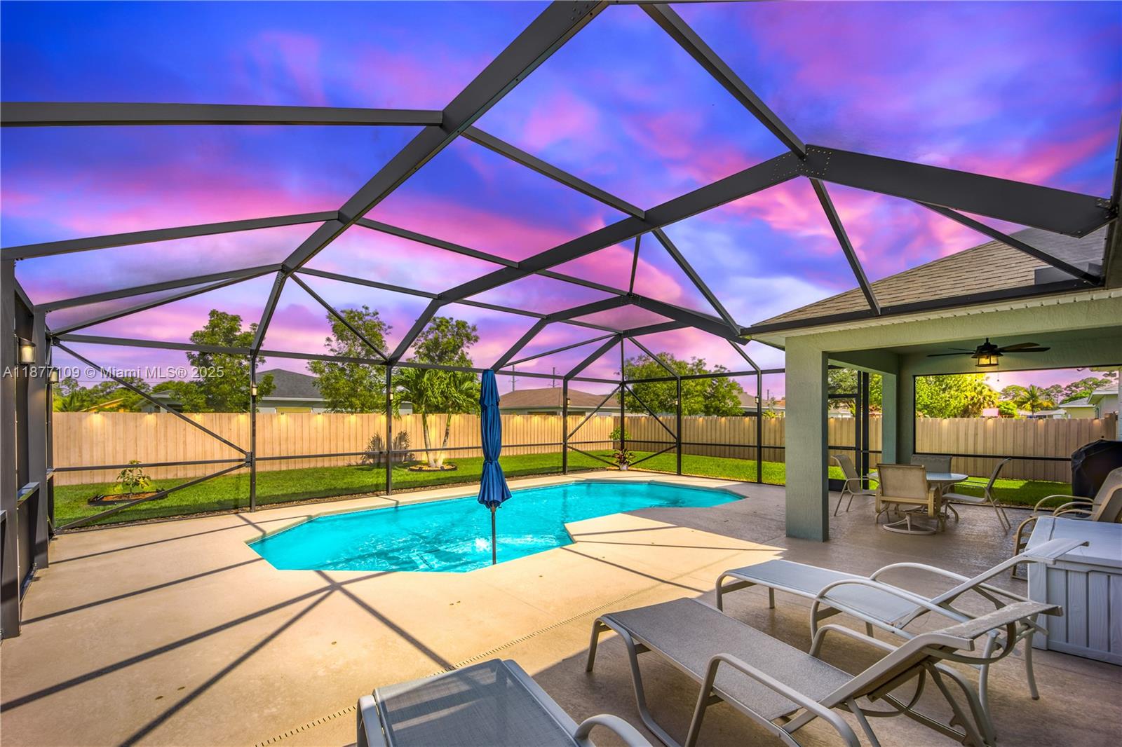 Fully furnished 3BR/2BA home with open-concept floor plan, screened lanai, and heated saltwater pool with sun shelf. Split-bedroom layout with primary suite separate from secondary bedrooms. Interior features include kitchen island with bar seating, foam mattresses with hotel collection pillows, Smart TVs in all bedrooms and living room, sofa bed, and refrigerator with water filtration system. Exterior offers fully fenced backyard, 4-car driveway, and 2-car garage. Located minutes from Tradition, I-95, Cleveland Clinic Hospital, shopping, dining, approx. 30 minutes to Jensen Beach, and walking distance to Peacock Lake. Month-to-month or short-term rental upon request. Corporate leases considered, available immediately.