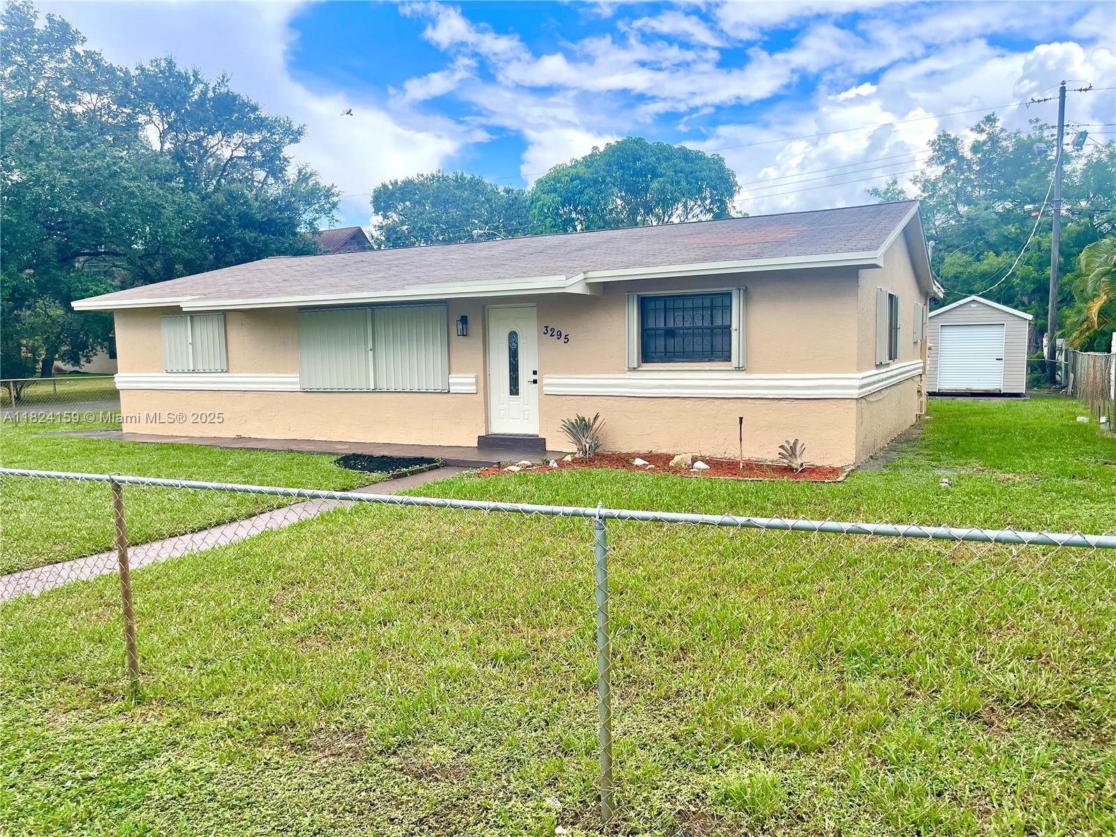 Discover this fully remodeled gem, perfect for anyone seeking space and comfort. Located on a corner lot, this house offers you a modern, worry-free lifestyle. Counts with three bedrooms and two full bathrooms, all featuring brand-new finishes including laminate floors, fresh paint, and contemporary bathroom designs. Open-concept kitchen and living room. Outside, surrounded by a perimeter garden that offers an endless possibilities for outdoor entertaining. The property also boasts a patio driveway with space for multiple vehicles, for all your parking needs. The house is well-equipped and ready for you to move in. Separate laundry room. Note: the AC system is only 2 years old and the Refrigerator, washer and dryer have less than 1 year of use - Equipped with Hurricane Shutters.