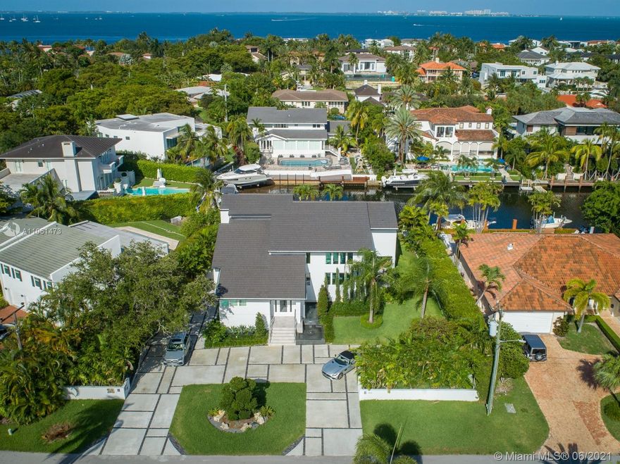 Sunshine, sea breezes and direct ocean access with no bridges to the Bay!!! Enjoy an incredible waterfront Miami lifestyle in this impeccably remodeled 5 bed/5 bath contemporary smart home complete with a 100 ft seawall & boat lift on a wide canal in the guard gated, upscale community of Sunrise Harbour in Coral Gables. From the floors to the roof, everything has been replaced including plumbing, electrical, glass wine room, Italian chef’s kitchen and impact glass throughout with pocket sliders that open completely to the terraces & pool inspiring indoor/outdoor entertaining. Features water views, a gym, garage, 2300+ sf of storage and premium location minutes from the Grove, South Miami, great schools and int'l airport. Start the best chapter of your life TODAY in this move-in ready home.