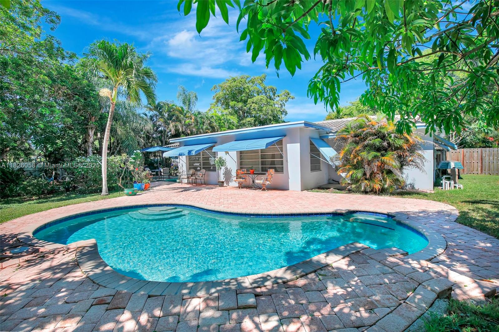 Sitting on a magnificent 1/3+ acre lot, this Plantation show stopper offers resort-style living with a sparkling pool, swaying palms and lush tropical gardens. Inside, enjoy an updated kitchen with a new dishwasher, refrigerator and microwave, renovated bath, extra den and a new gas water heater. Outside, escape to a private oasis - fruit and shade trees, native wildflowers and swaying palms. With an enormous yard, there's plenty of space for play structures, perfect for family fun and entertaining. Nestled in Historic Plantation you're near to Plantation Woods Park, Historical Museum, Plantation Athletic League Field, Hoffman Park (Deicke Auditorium), basketball & racquet courts, golf course, Peter’s Elementary, and the Soref JCC. Near shopping, expressways. NO Homeowner's Association!!!