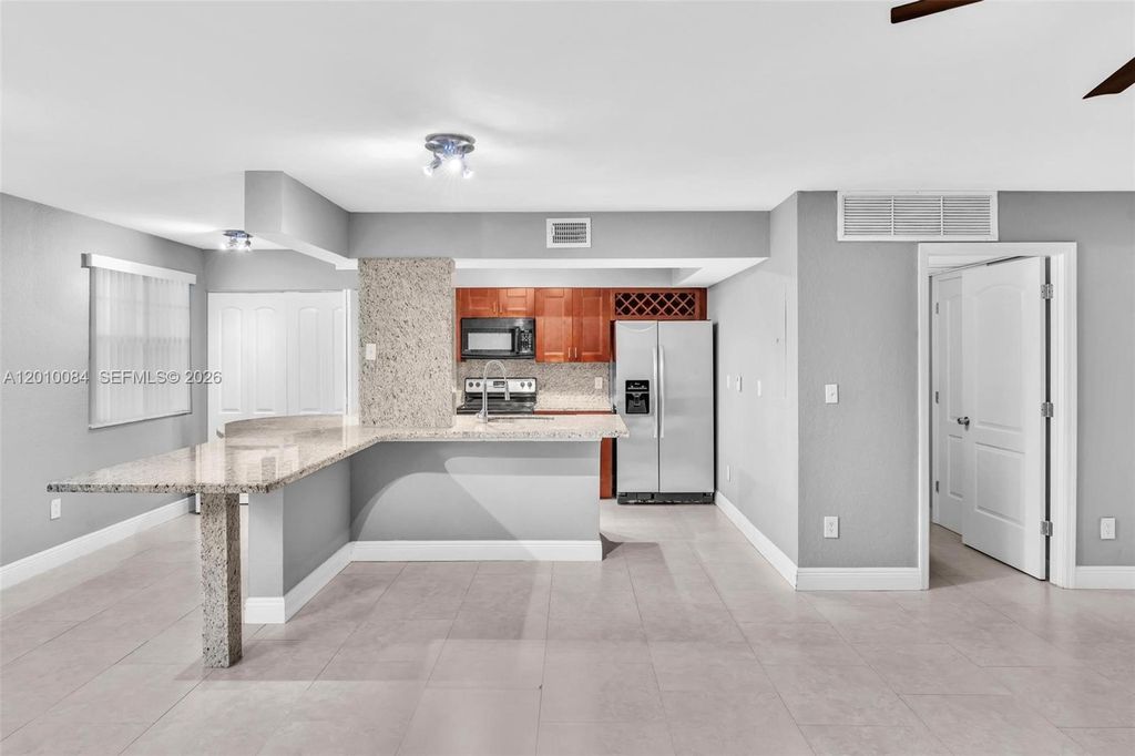 Photo of 2881 N Oakland Forest Dr #105, Oakland Park, FL 33309 (MLS # A12010084)