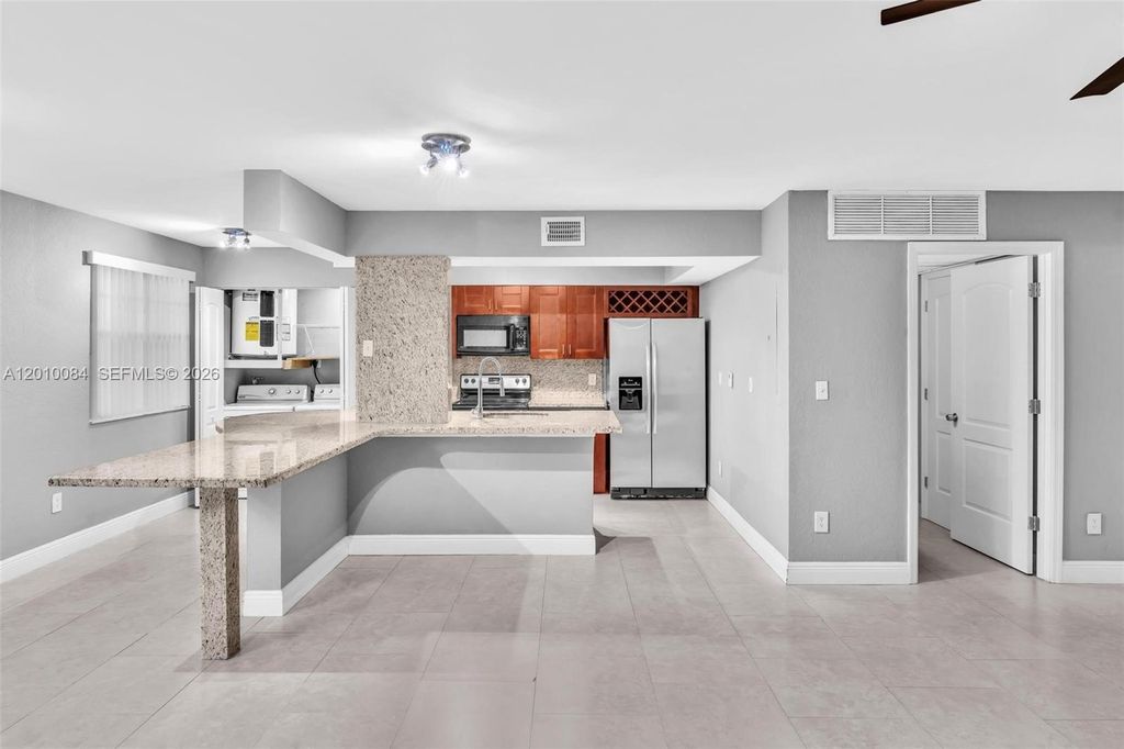 Photo of 2881 N Oakland Forest Dr #105, Oakland Park, FL 33309 (MLS # A12010084)