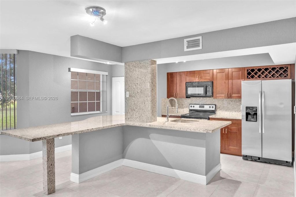Photo of 2881 N Oakland Forest Dr #105, Oakland Park, FL 33309 (MLS # A12010084)