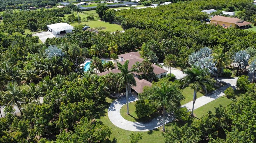 Beautifully updated & landscaped, this electronically gated 10-ac. Redlands estate features a custom horse stable, large steel paddocks, pool,& an income-producing avocado grove. The 4BR/4BA home offers a new roof, 3- 2023 Trane A/C units, a whole house filtration system, marble floors, renovated baths, gas fireplace, a stunning fully updated kitchen in 2025 w/granite countertops & French doors opening to the pool. A lush nature path leads to a custom (35x 31) 6-stall barn that includes an attached 1BR/1BA apartment. The grounds showcases a koi pond & variety of exotic fruit trees such as jackfruit, starfruit, dragon fruit, miracle fruit, & more. A rare opportunity to own a private sanctuary in the Redlands. PROOF OF FUNDS AND/OR PRE-APPROVAL LETTER REQUIRED PRIOR TO SCHEDULING A SHOWING