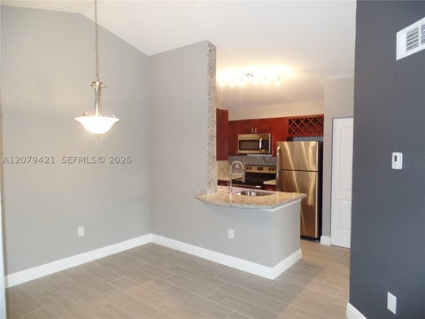 Photo of 2881 N Oakland Forest Dr #311, Oakland Park, FL 33309 (MLS # A12079421)