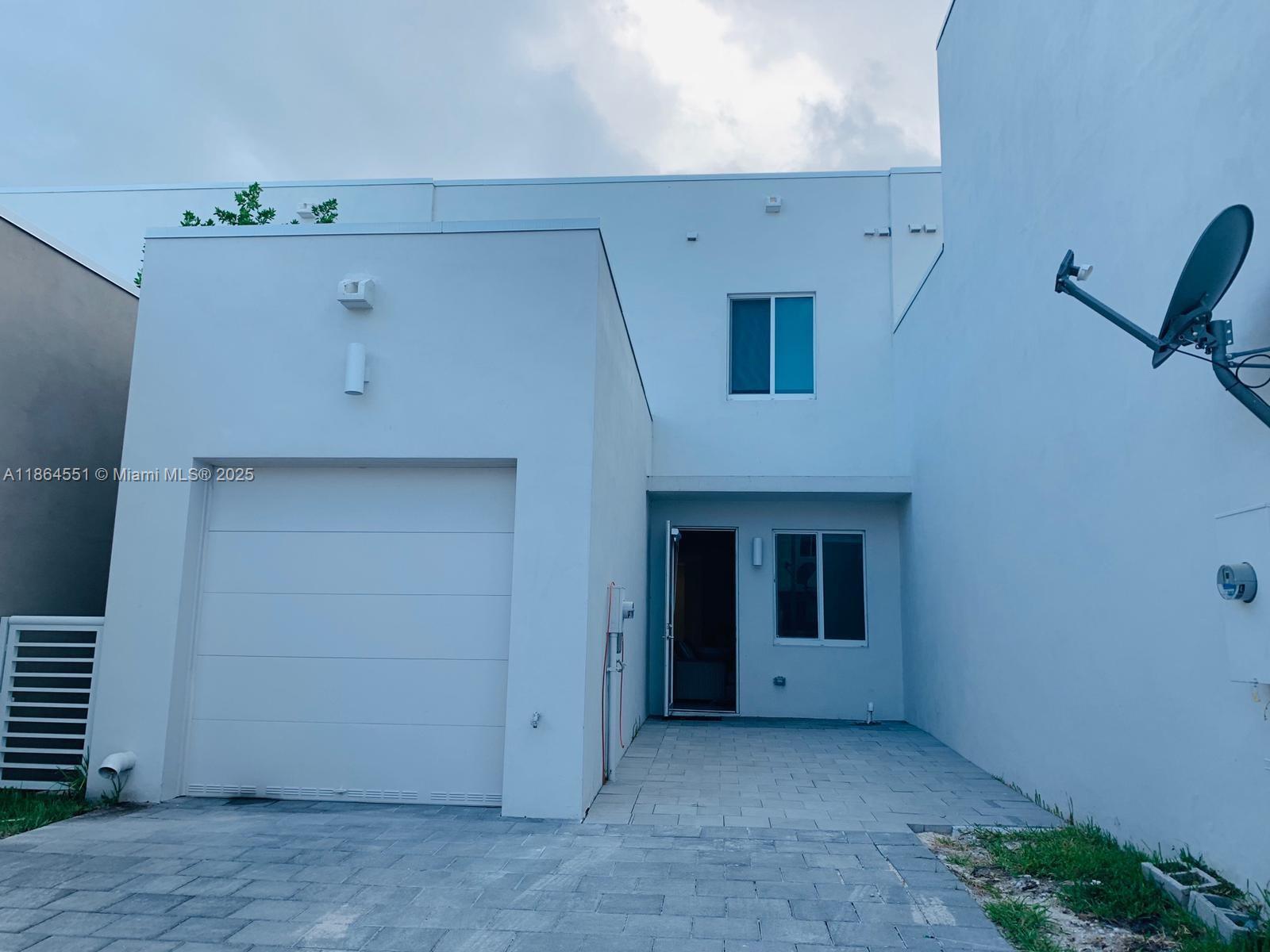 Beautiful townhome in Doral, located in front of Doral International Academy of Math and Science. It features 4 bedrooms and 3 full bathrooms, with one bedroom and bathroom conveniently located on the first floor. There is a covered garage for one vehicle, plus additional space for two cars and extra guest parking available. The home is equipped with impact-resistant windows and doors. Residents have access to the resort-style clubhouse with beautiful amenities and common areas.