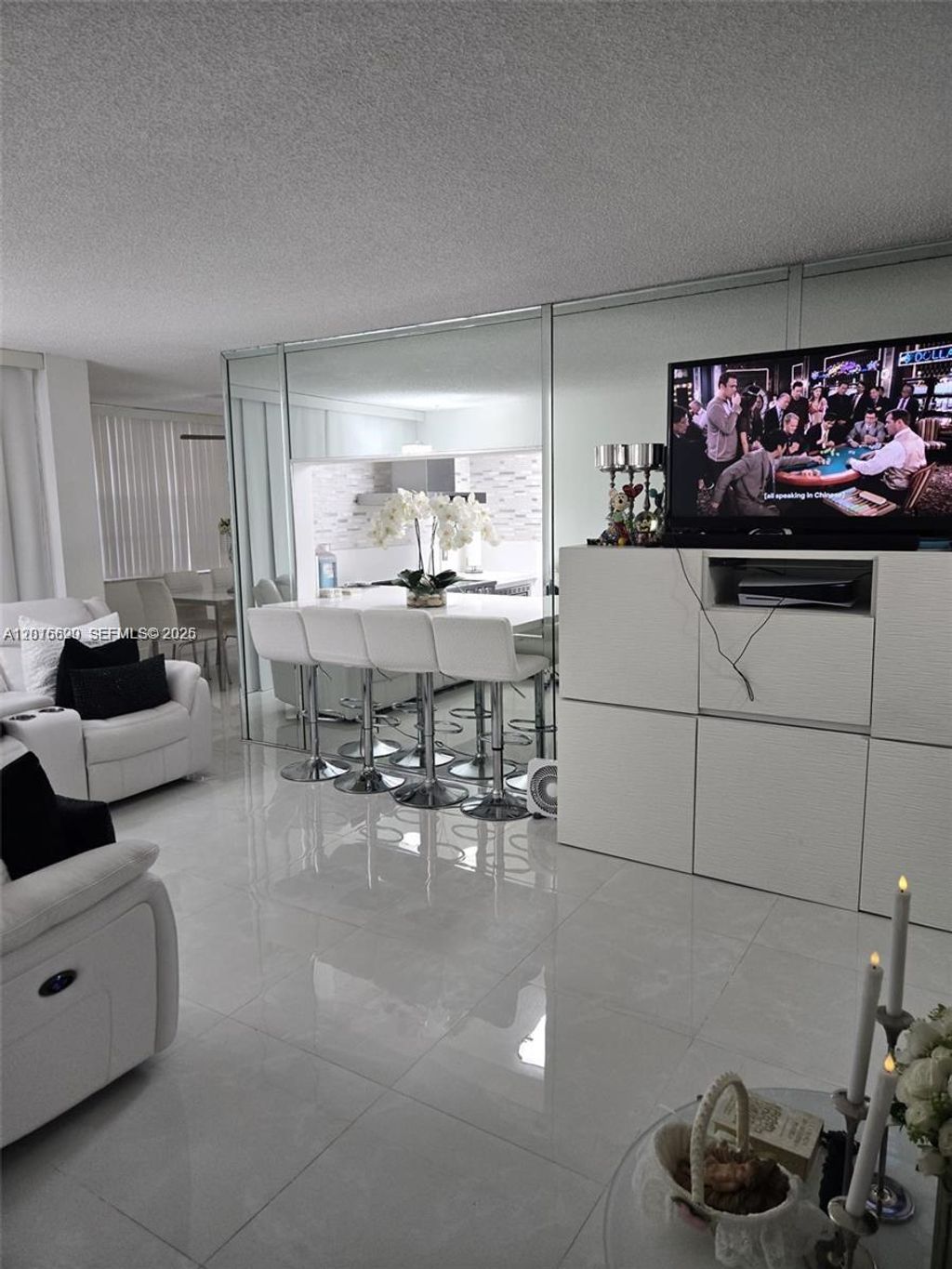 Photo of 9410 Live Oak Pl #103, Davie, FL 33324 (MLS # A12016620)