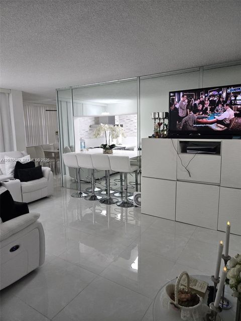 Photo of 9410 Live Oak Pl #103, Davie, FL 33324 (MLS # A12016620)