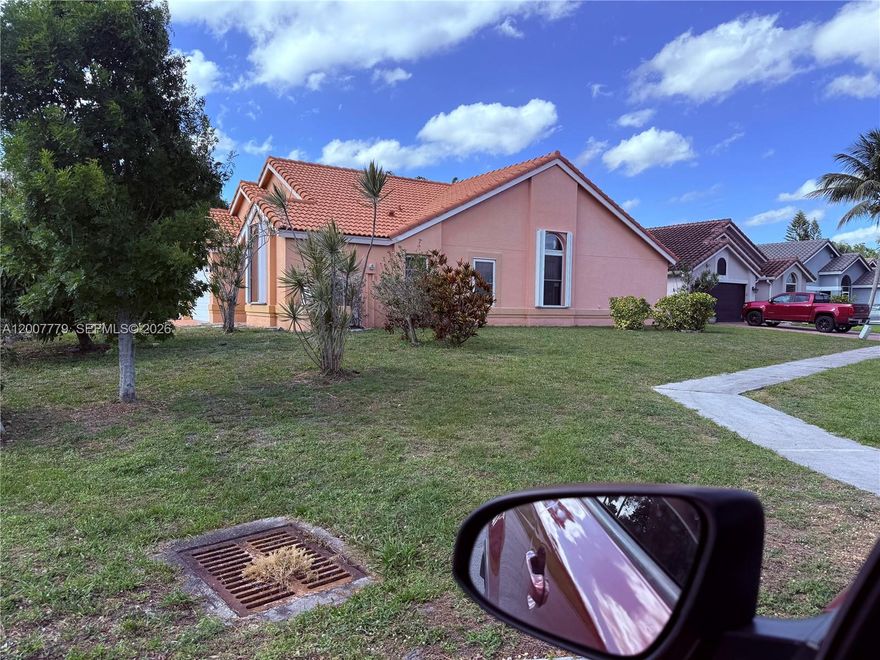 Nice corner lot with ard in all 4 corners of the house,may fence in for dogs .Hurricane impact windows and  hurricane impact sliding glass doors in entire house except for master bedroom protected against wind . Accordeon shutters in some windows and both sliding glass doors. Open floor living room with vaulted ceilings. Spacious master bedroom  with 2 walk in closets.Split bedrooms. Owner/Broker