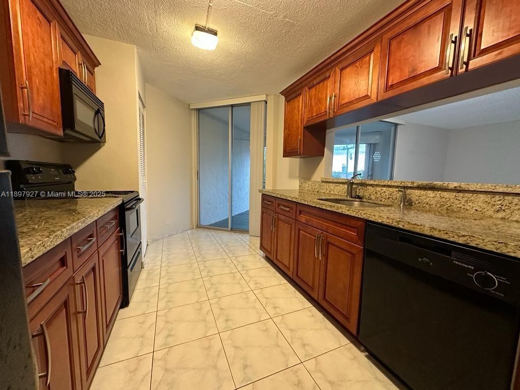 Photo of 3100 N Pine Island Rd #310, Sunrise, FL 33351 (MLS # A11897927)