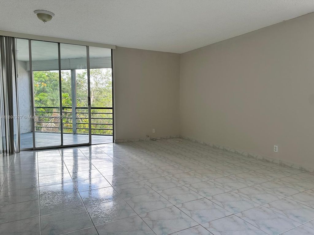 Photo of 3100 N Pine Island Rd #310, Sunrise, FL 33351 (MLS # A11897927)