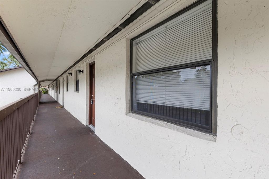 Photo of 6061 Shakerwood Cir #206, Tamarac, FL 33319 (MLS # A11960200)